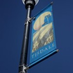 A street light with a painting of Tisdale