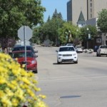 A white car moving on a road